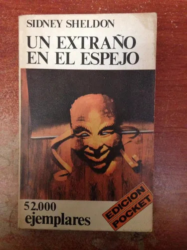 Libro usado en venta: Un extra?o en el espejo (Pocket) de Sidney Sheldon; editorial Emece impreso en 1977 realizamos envios a todo el mundo.1