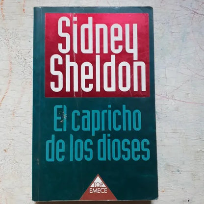 Libro usado en venta: El capricho de los dioses de Sidney Sheldon; editorial Emece impreso en 1999 realizamos envios a todo el mundo.1