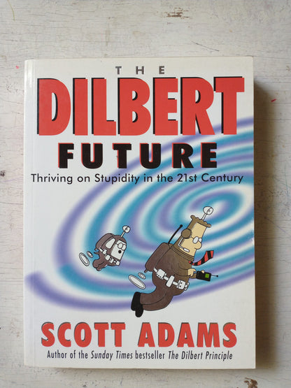 Libro usado en venta: The dilbert future de Scott Adams; editorial Macmillan impreso en 1998 realizamos envios a todo el mundo.1